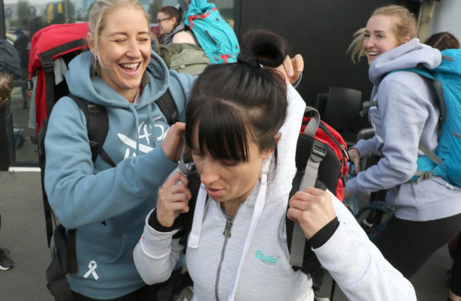 Loading up for another pack march  were (from left) Adrienne Lester, Sammy Cook and Amy Beach, ...