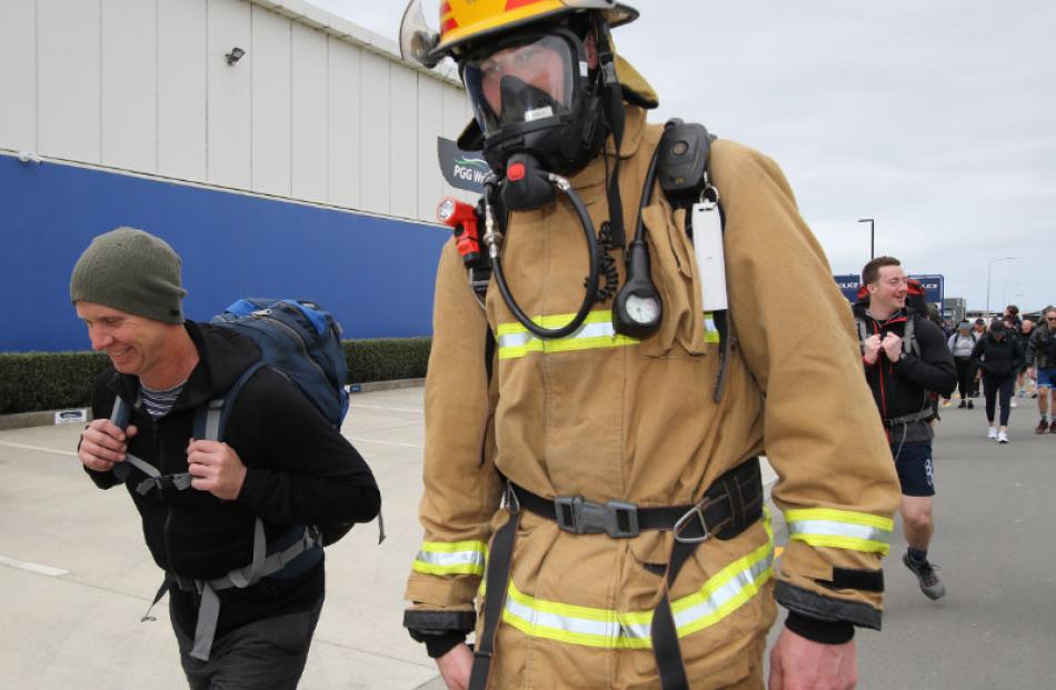 Fire Fighter Logan Retallick walked each of the pack march sessions carrying full breathing...