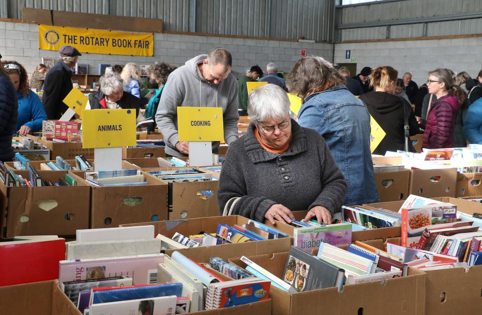 Searching . . . A large number of shoppers attended the Rangiora A&P show grounds last week PHOTO...