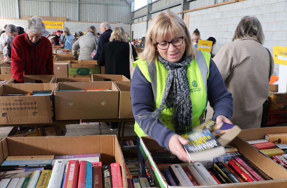 More to come . . .Rangiora Rotarian Liz Ditmer restocks the hard cover non fiction novels on...