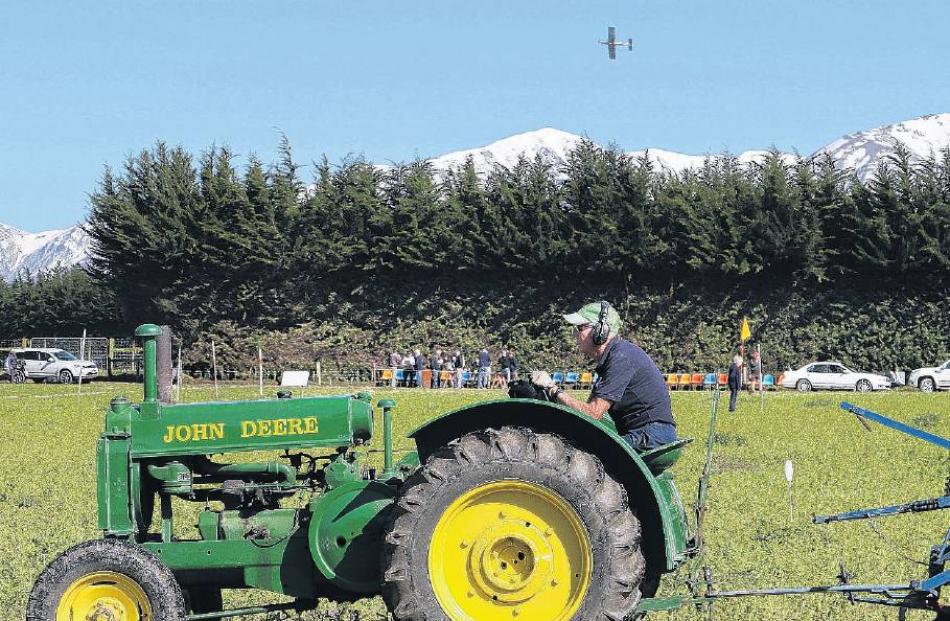 Fly past . . . Pearce Watson of Ashburton aboard his 1938 John Deere tractor, starts his first...