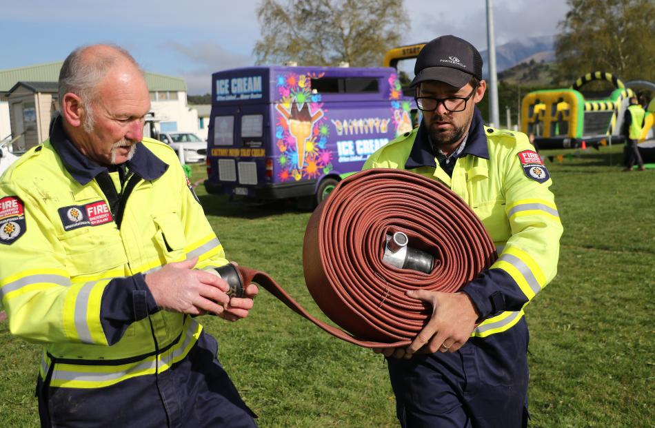 Oxford Volunteer Fire Brigade Chief Fire Officer Trevor Ealam works with new recruit fire fighter...