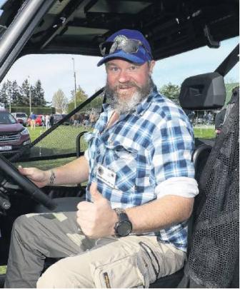 Fun driving . . . Oxford and districts Lions Club member Tim Kenneth helped out driving the slow...