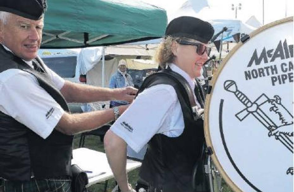 Helping hand . . . McAlpines North Canterbury Pipe Band piper Lindsay Fletcher helps drum...