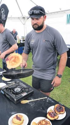 Tossed . . . Waimakariri candidate George Watson flips his pikelet creation as he competes in the...