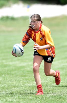 Dunstan High School pupil Dayla Turnbull (14) weighs up her options during a rugby sevens game.