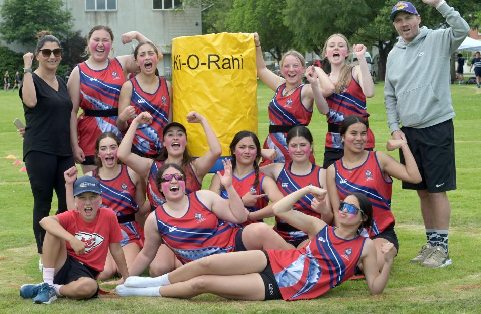 The Queen’s High School team celebrates its efforts.