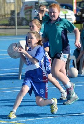 Bridget O'Neill, of St Mary's Primary School,  controls the ball as Kaitlyn Hastie (10), of East...