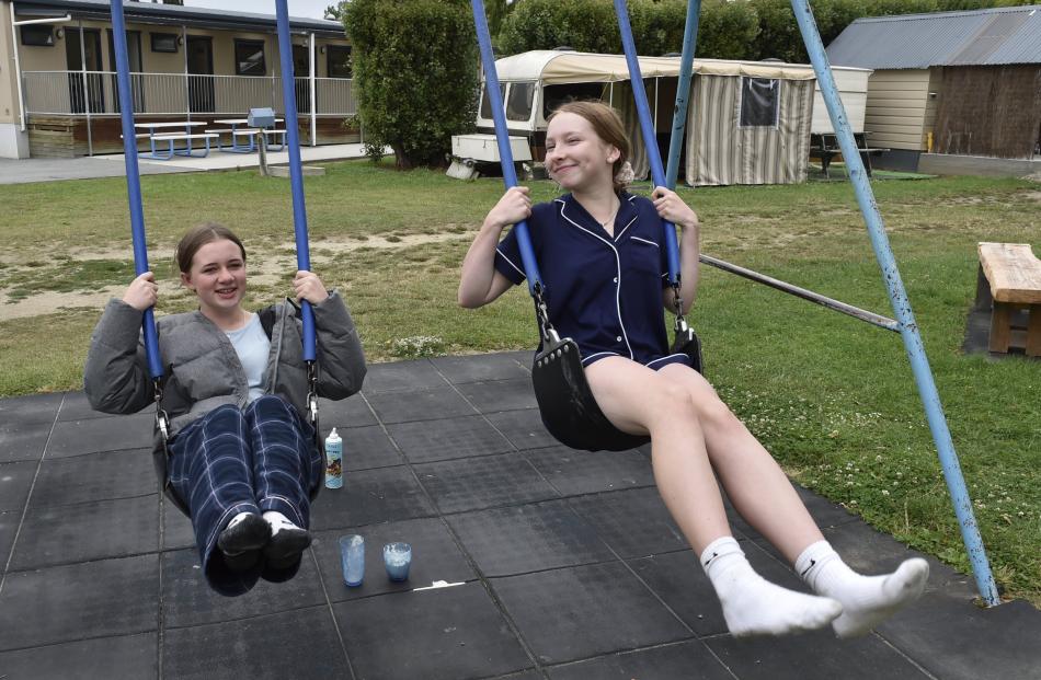 Enjoying a swing at the Alexandra Holiday Park are Emily Donnelly (14, left) and Lyla Corstensen ...