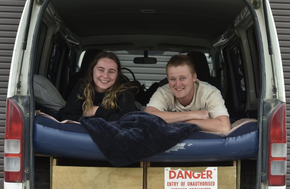 Brittany Dodds and Connor Harvey, both of Invercargill, watch the world pass by from their spot...