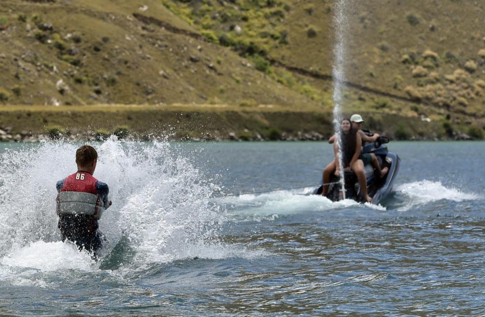 Harry Ollerenshaw (17), of Stirling, is about to stand up on his water-ski, being towed by his...