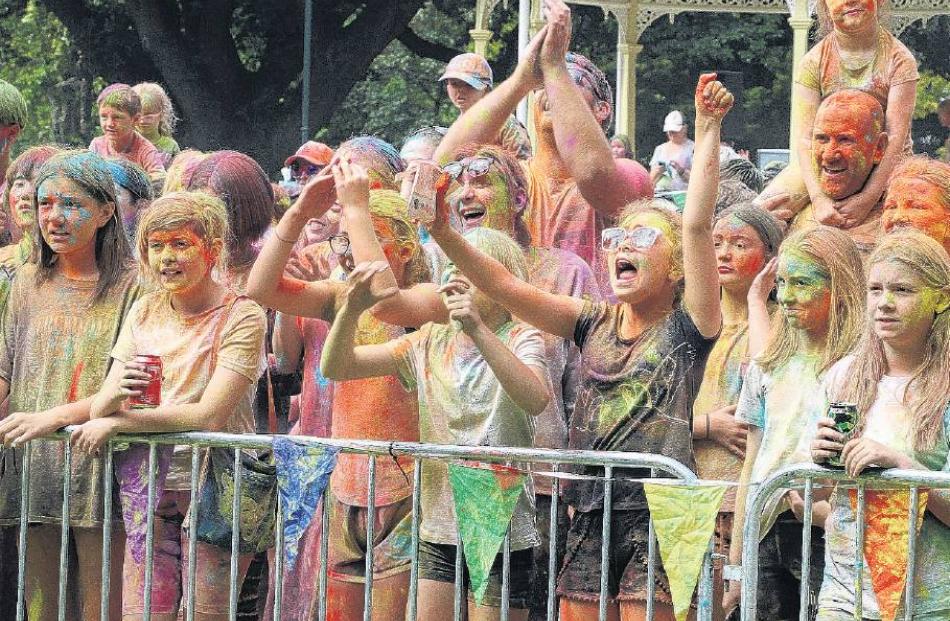 Happy colours . . . The large crowd enjoys the show at the Pak’nSave Rangiora Festival of Colour,...