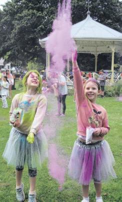 In the air . . . Throwing colours were sisters Ava, aged 7, and Eliza Foster, 9, of Pegasus....