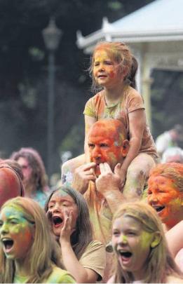 A better view . . . Ella Sands, aged 6, has the best view from the shoulders of dad, Mike Sands....