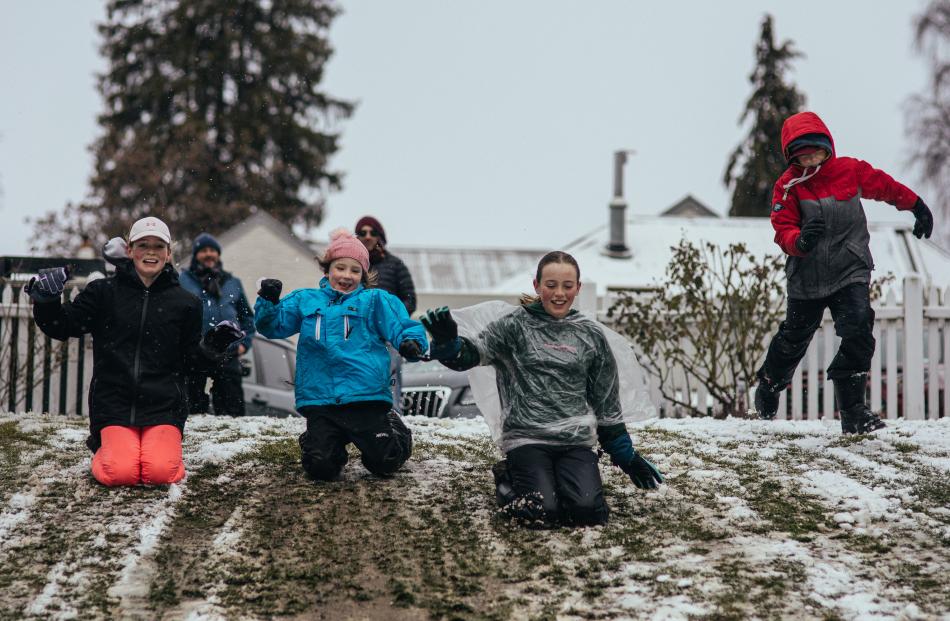 Ella McManus (12), Juliette Christensen (7), Ruby McManus (12), Jack Christensen (12) sliding...