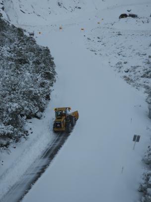 A snow plough makes its way to the Homer Tunnel on the Milford Road this morning. Photo: Waka...