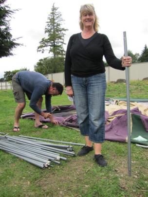 Rob and Wendy Taylor, of Mosgiel, make short work of systematically putting up their tent.