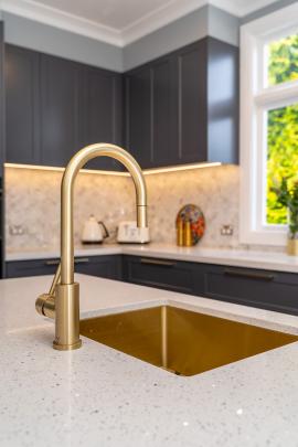 The brass sink wears well and doesn’t scratch or discolour, homeowner Charlotte Ford says.