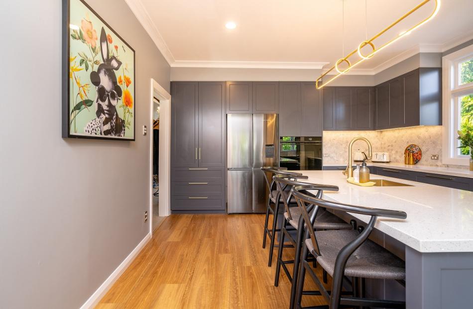 The kitchen, with its L-shaped layout and peninsula, has plenty of bench space. PHOTOS: GARETH...