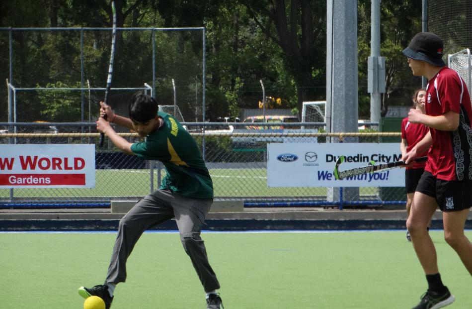 Rangam Rathod (Bayfield) prepares to unleash on the ball in a renegade hockey game.