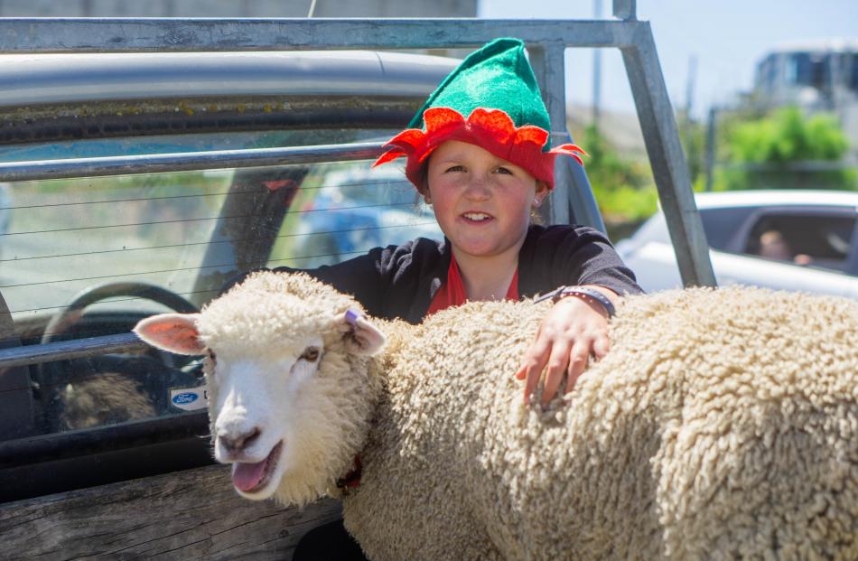 Charlotte Thompson, 10, and her 4-month-old lamb, Hope.