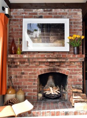 Bricks salvaged from a polytechnic building were used in one of the home’s  fireplaces. The...