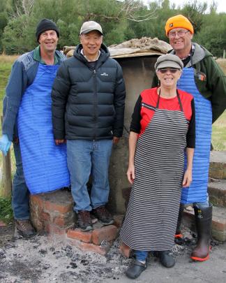 Local Lawrence field kitchen pork chefs (from left) Hamish Dalziel, Hector Wong, butcher Jan...