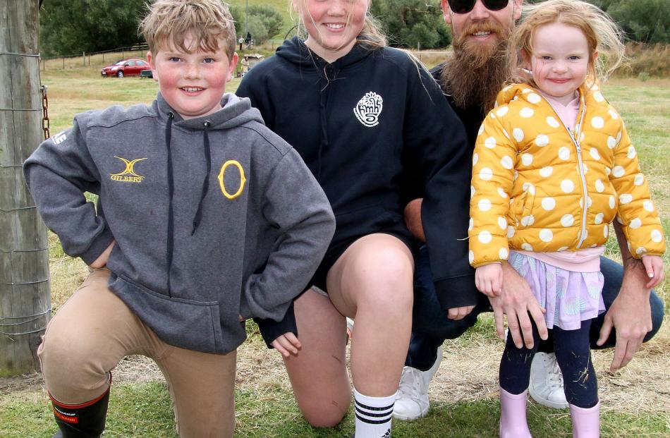 Chris Wilson, of Dunedin, and James Purvis (9), Macie Wilson (11) and Tilly Purvis (4), all of...