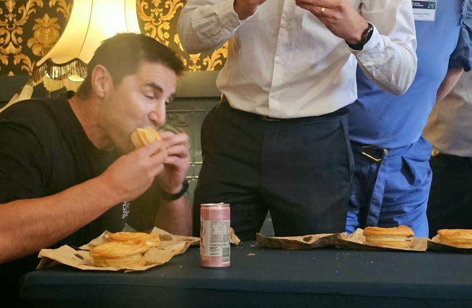 Richard Wheeler sets the competition pace as he devours his pie.