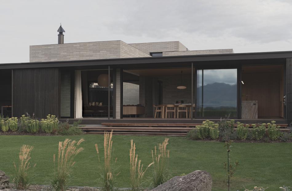 Wānaka S.K.I House by Roberts Gray Architects has a blank facade that the awards jury said gives...