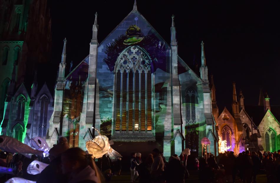 Images are projected on to an illuminated First Church, in Moray Pl.