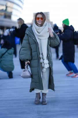 A guest wears a full-length khaki puffer jacket during the Copenhagen Fashion Week earlier this...