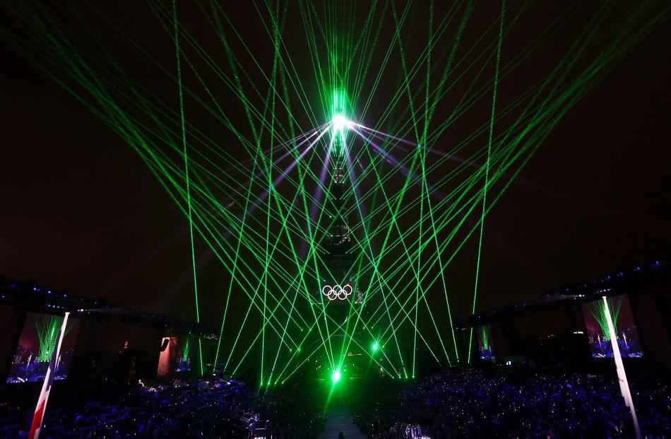 The Eiffel Tower is bathed in laser light. PHOTOS: REUTERS