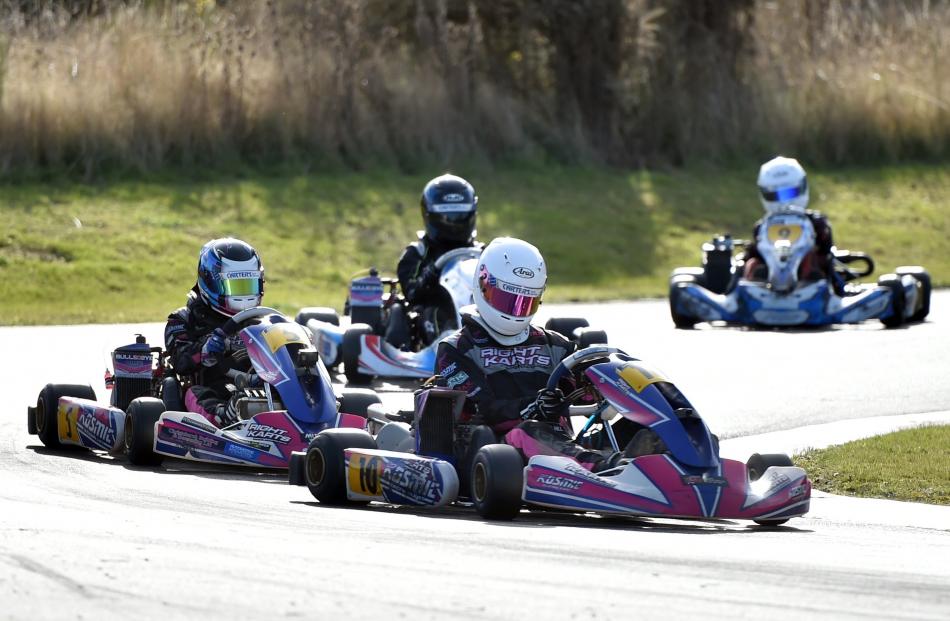 Racers tear around the North taieri track.