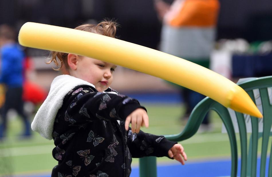 Grace Gibson, 3, makes her mark in the javelin. 