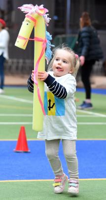 Agnes Hanson, 3, tries to keep control of her horse, Charlie, during the equestrian event. 