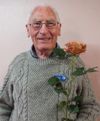 George Agnew, ORS president 2006-08, holds ‘Julia’s Baby’, a successful rose he and his wife Dawn...