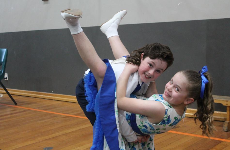 Ethan Flowers, 9, and Tillie Johnstone, 9, show their rock ’n’ roll moves.