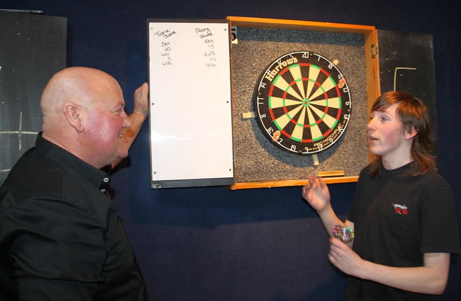 Daniel Maze and 16-year-old Shane Taylor talk tactics in a doubles game.