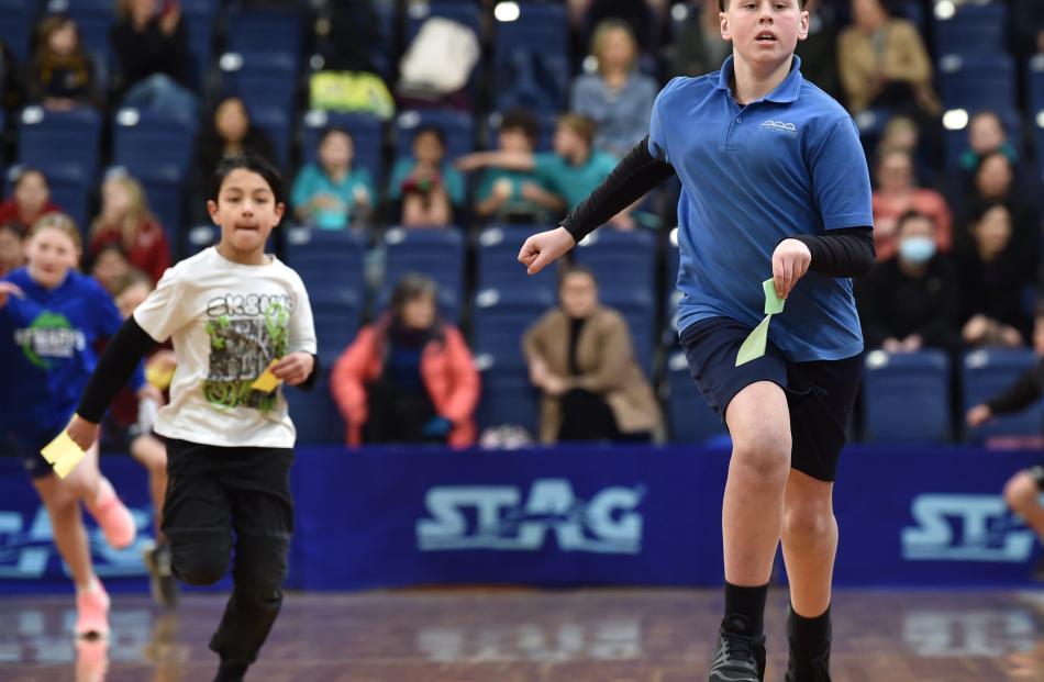 Balclutha Primary School pupil Corey Newport, 11, runs with his answer to a maths equation.