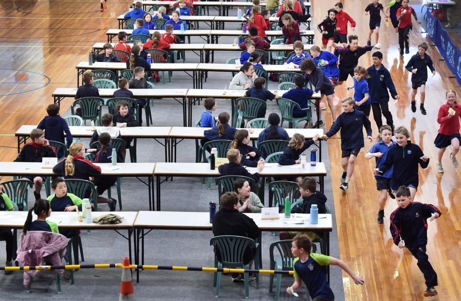 Year 6 pupils from across Dunedin run their answers as quickly as possible to their markers at...