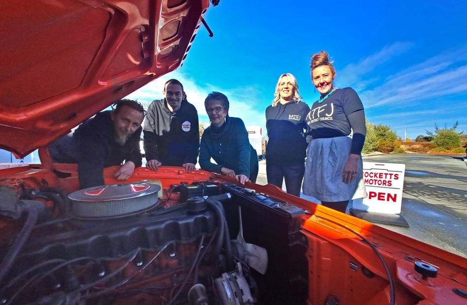 Mocketts Motors owner Chris Gudsell (left), automotive engineering apprentice Marco Shepherd,...