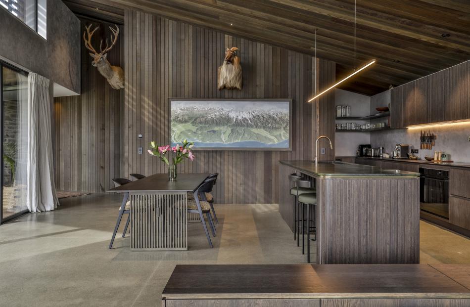 Timber and concrete feature in the kitchen-dining area.