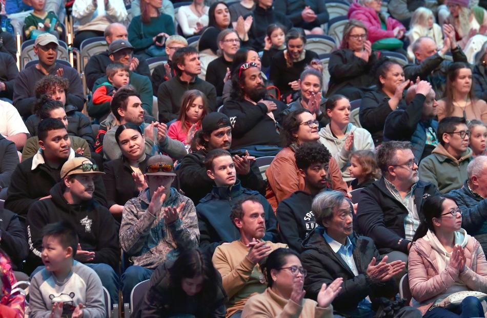 Spectators watch the performances.