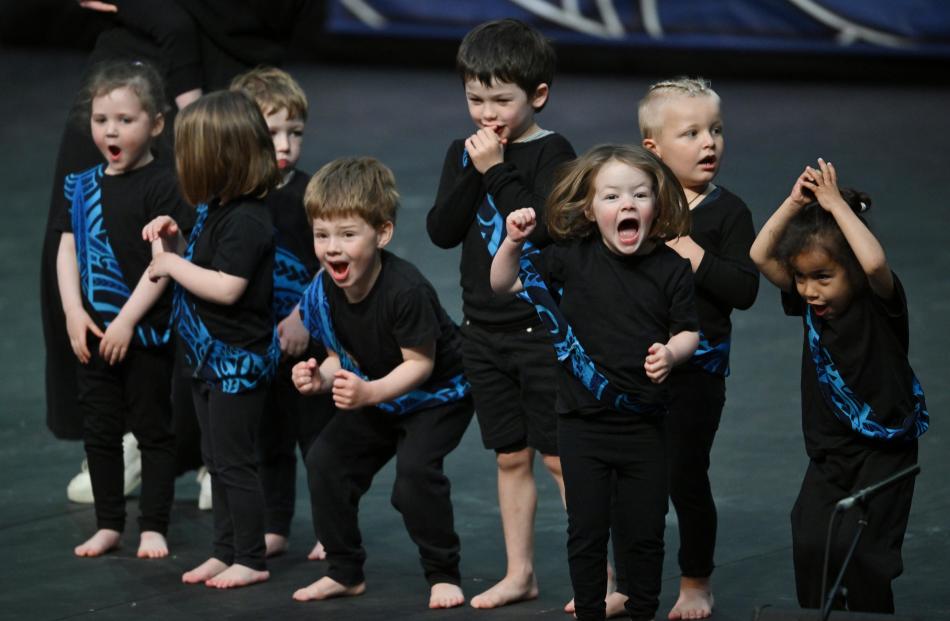 Children from Halfway Bush Kindergarten give it their all.