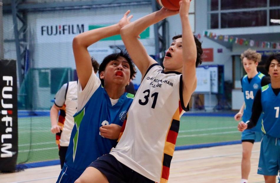 John McGlashan basketballer Asher Le Cong heads to the basket during the zonal tournament at the...