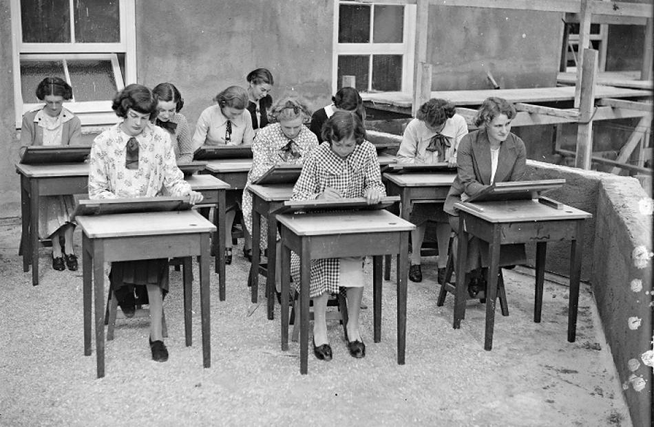 Students sketch on their new ‘‘roof studio’’, from which they had a superb view of the city, in...