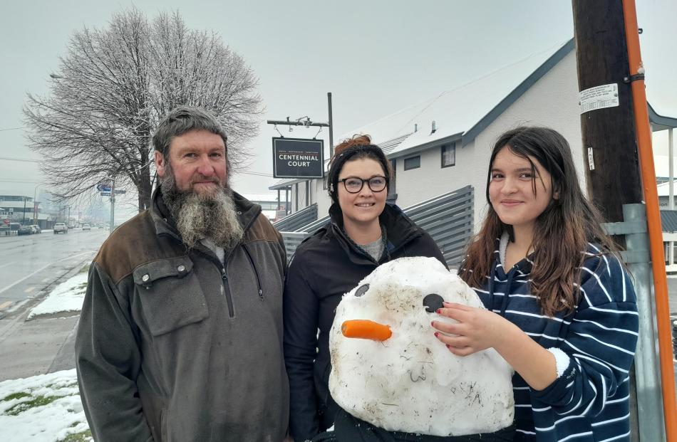 Centennial Court motel owner Kera McKenzie (centre) with father Croz Crospie and her daughter...