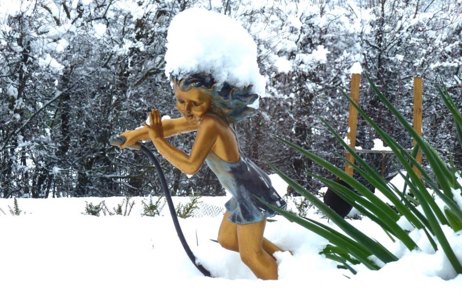 Lily the garden girl braves the snow at Arrowtown Lifestyle Village. Photo: Jim Fraser

