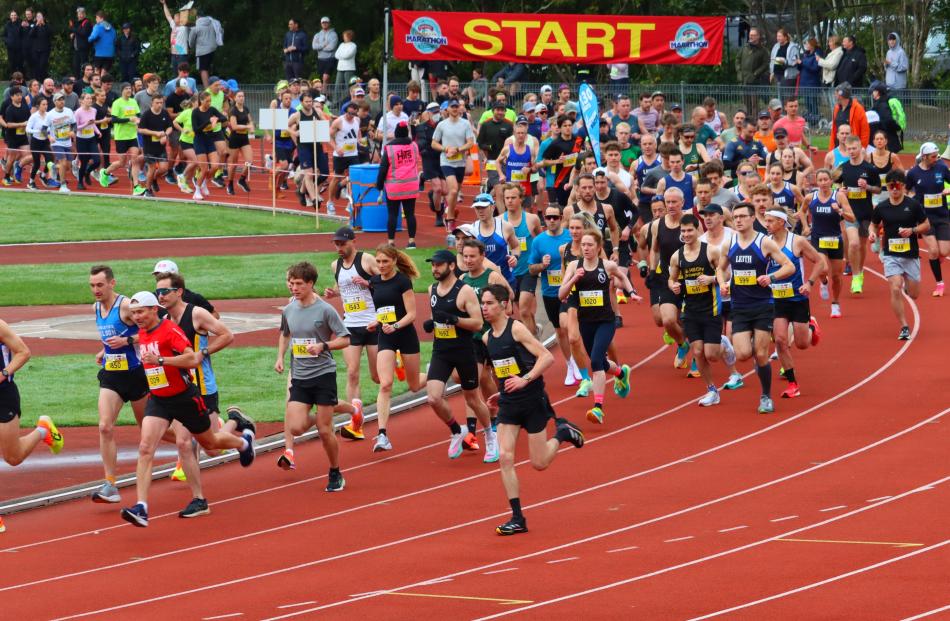 Time starts now ... Runners get under way at the start of the half marathon from the Caledonian...